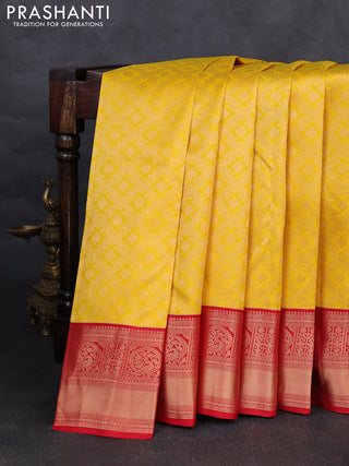 Pure kanchipuram silk saree yellow and red with allover zari woven brocade weaves and rich zari woven korvai border