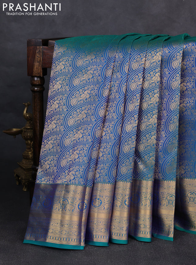 Pure kanchipuram silk saree dual shade of bluish green with allover zari woven peacock brocade weaves and rich zari woven border