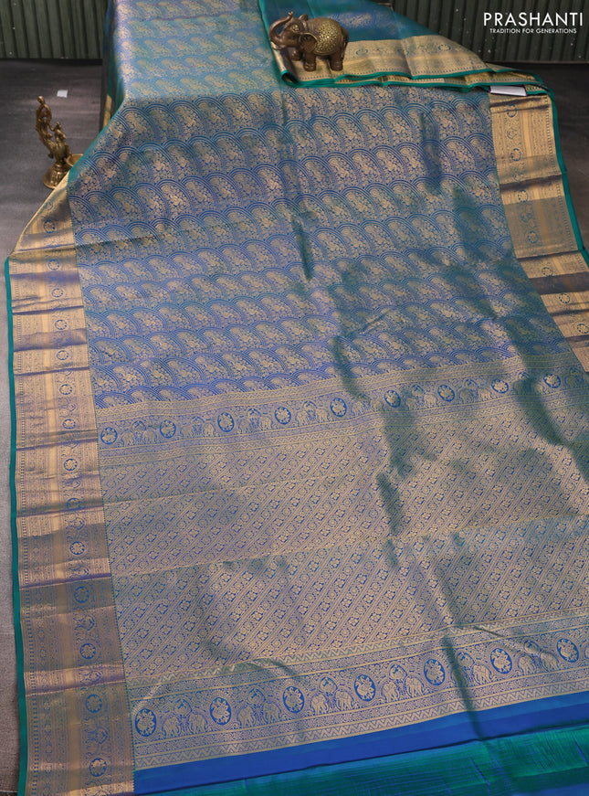 Pure kanchipuram silk saree dual shade of bluish green with allover zari woven peacock brocade weaves and rich zari woven border