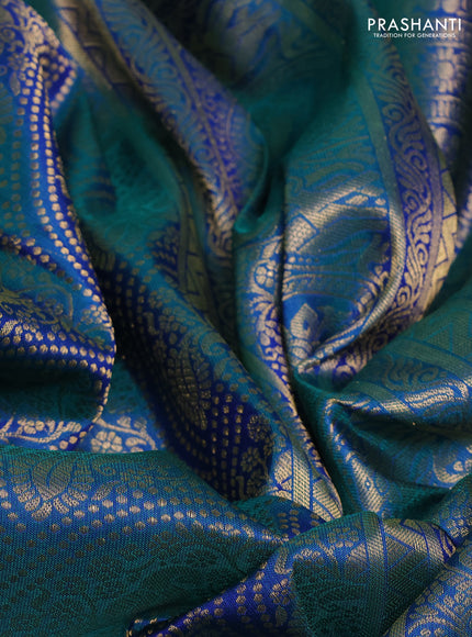 Pure kanchipuram silk saree dual shade of bluish green with allover zari woven peacock brocade weaves and rich zari woven border