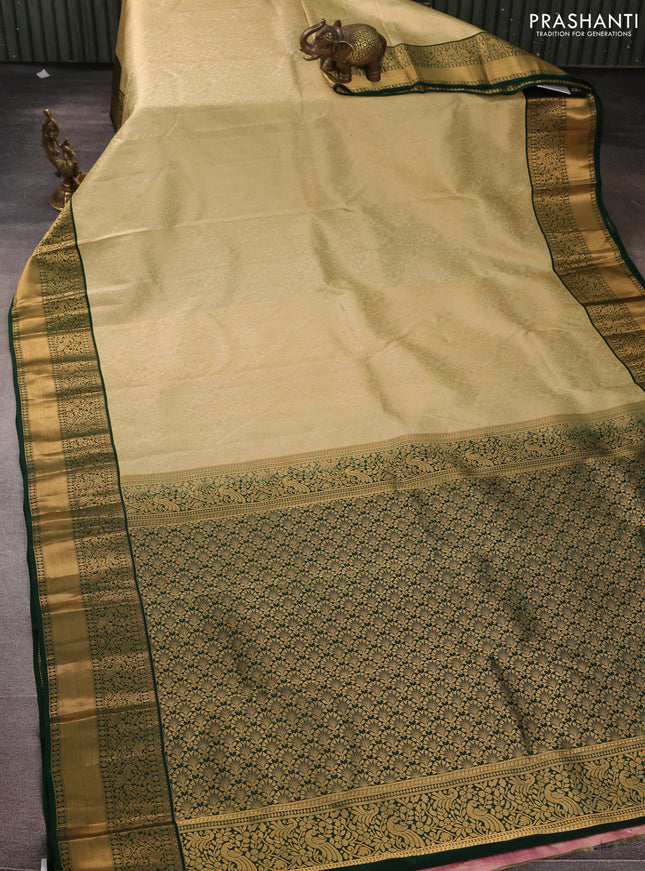 Pure kanchipuram silk saree mild pista green and green with allover zari woven brocade weaves and rich zari woven korvai border