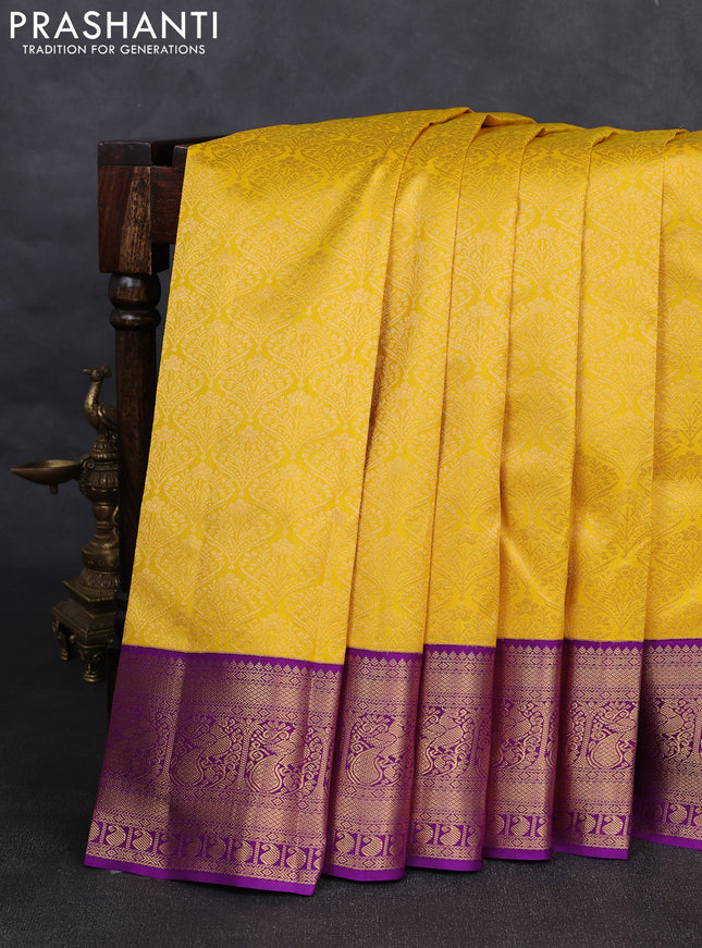 Pure kanchipuram silk saree yellow and purple with allover zari woven brocade weaves and rich zari woven korvai border