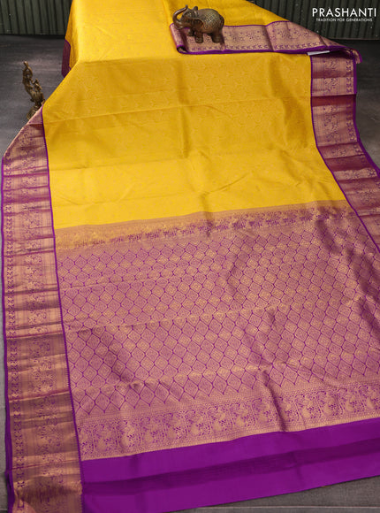 Pure kanchipuram silk saree yellow and purple with allover zari woven brocade weaves and rich zari woven korvai border