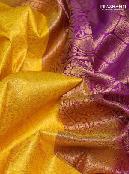 Pure kanchipuram silk saree yellow and purple with allover zari woven brocade weaves and rich zari woven korvai border