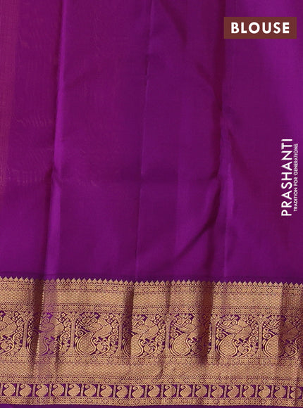 Pure kanchipuram silk saree yellow and purple with allover zari woven brocade weaves and rich zari woven korvai border