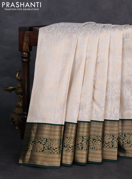 Pure kanchipuram silk saree off white and bottle green with allover zari woven brocade weaves and rich zari woven korvai border