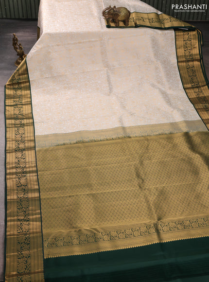 Pure kanchipuram silk saree off white and bottle green with allover zari woven brocade weaves and rich zari woven korvai border