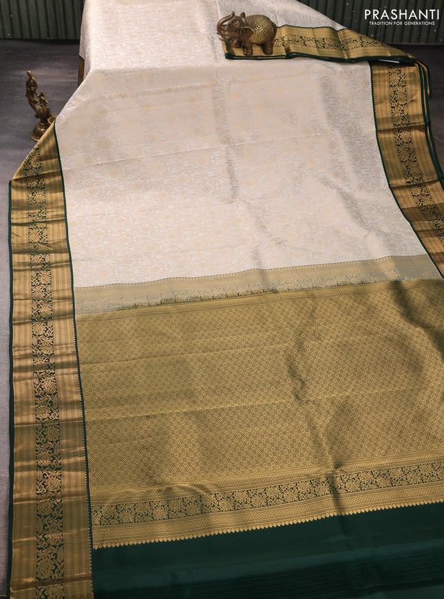 Pure kanchipuram silk saree off white and bottle green with allover zari woven brocade weaves and rich zari woven korvai border