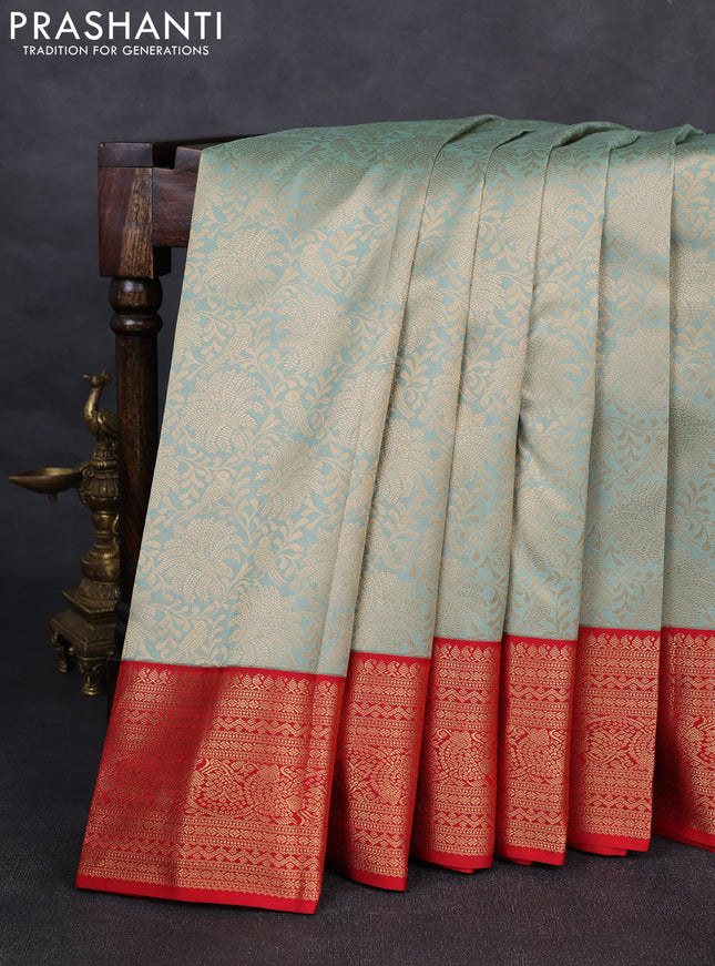 Pure kanchipuram silk saree pastel green and red with allover zari woven brocade weaves and rich zari woven korvai border