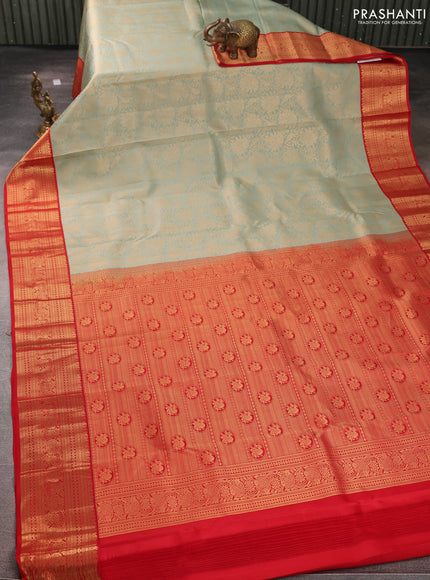 Pure kanchipuram silk saree pastel green and red with allover zari woven brocade weaves and rich zari woven korvai border