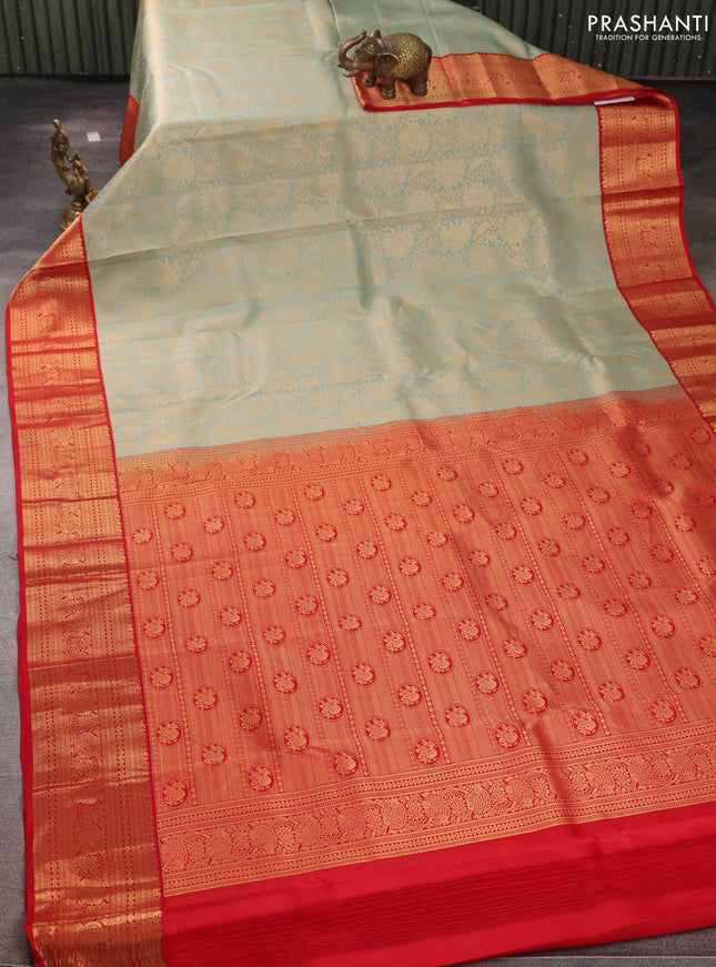 Pure kanchipuram silk saree pastel green and red with allover zari woven brocade weaves and rich zari woven korvai border