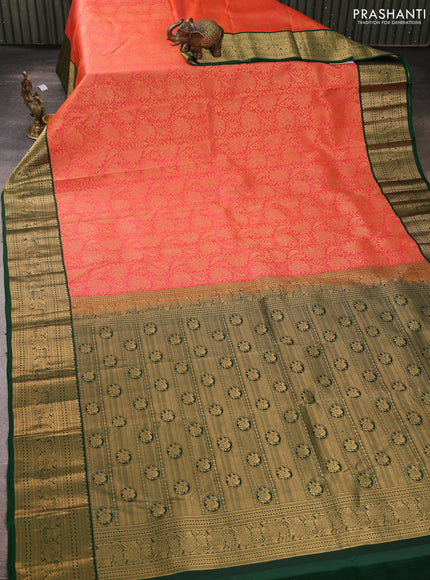 Pure kanchipuram silk saree peach orange and bottle green with allover zari woven brocade weaves and rich zari woven korvai border