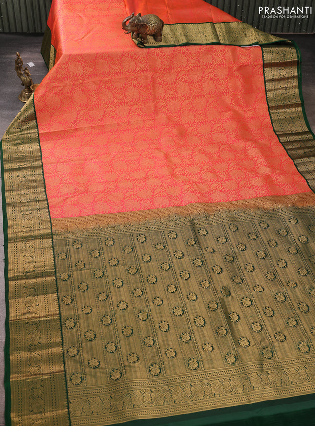 Pure kanchipuram silk saree peach orange and bottle green with allover zari woven brocade weaves and rich zari woven korvai border