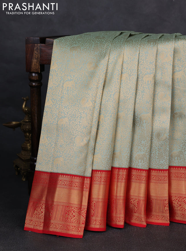 Pure kanchipuram silk saree pastel green and red with allover zari woven brocade weaves and rich zari woven korvai border