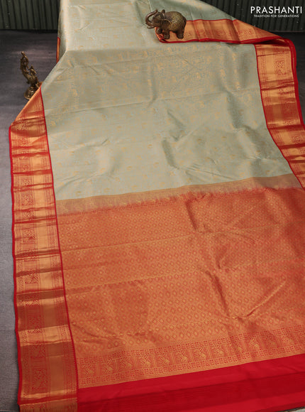 Pure kanchipuram silk saree pastel green and red with allover zari woven brocade weaves and rich zari woven korvai border