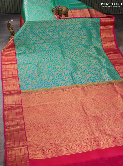 Pure kanchipuram silk saree teal green and pink with allover zari woven brocade weaves and rich zari woven korvai border