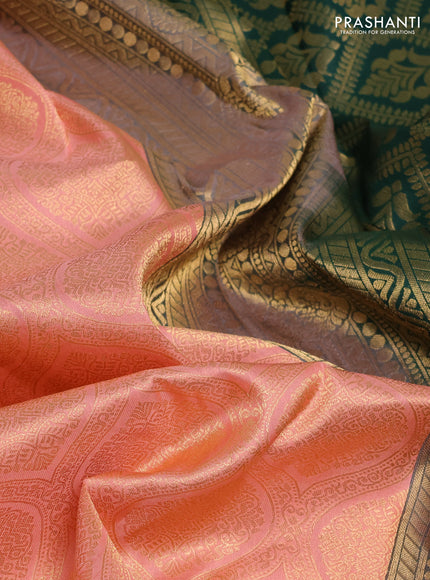 Pure kanchipuram silk saree peach and orange with allover zari woven brocade weaves and rich zari woven korvai border