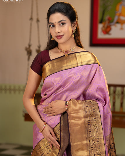 Pure kanchipuram silk saree lavender and deep jamun with allover zari woven brocade weaves and rich zari woven korvai border