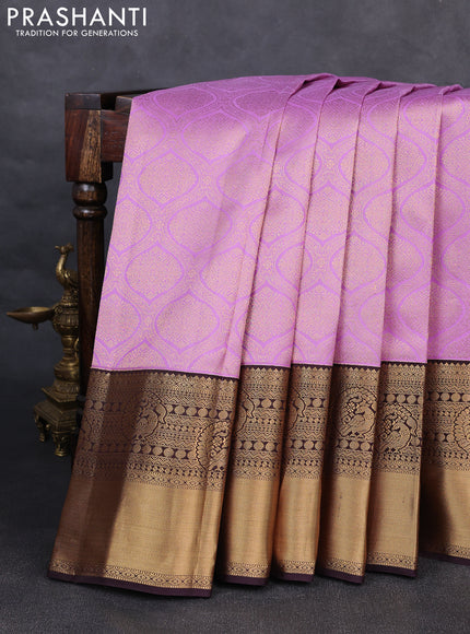 Pure kanchipuram silk saree lavender and deep jamun with allover zari woven brocade weaves and rich zari woven korvai border