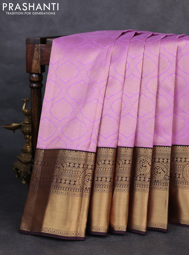 Pure kanchipuram silk saree lavender and deep jamun with allover zari woven brocade weaves and rich zari woven korvai border