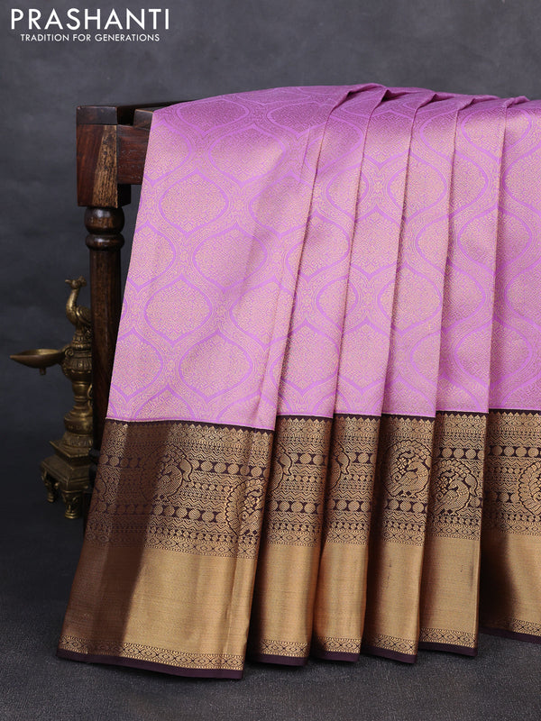 Pure kanchipuram silk saree lavender and deep jamun with allover zari woven brocade weaves and rich zari woven korvai border