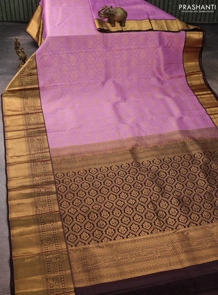 Pure kanchipuram silk saree lavender and deep jamun with allover zari woven brocade weaves and rich zari woven korvai border