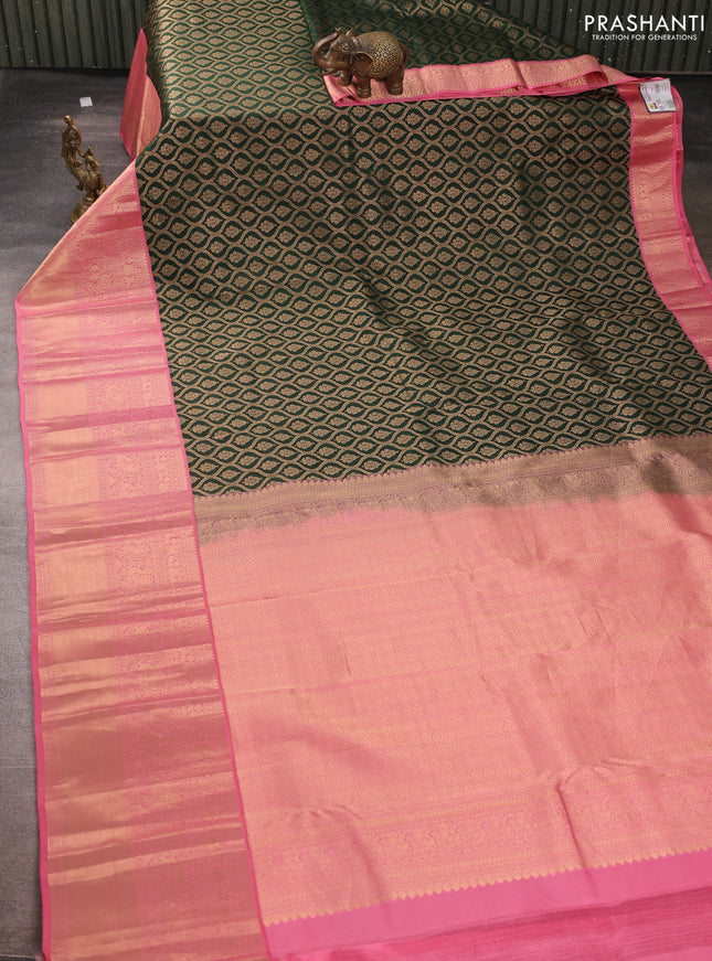 Pure kanchipuram silk saree bottle green and peach pink with allover zari woven brocade weaves and long rich zari woven korvai border