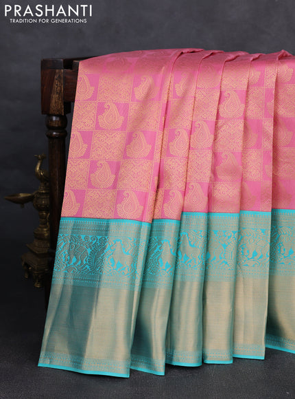 Pure kanchipuram silk saree light pink and teal blue with allover zari woven brocade weaves and long rich zari woven korvai border