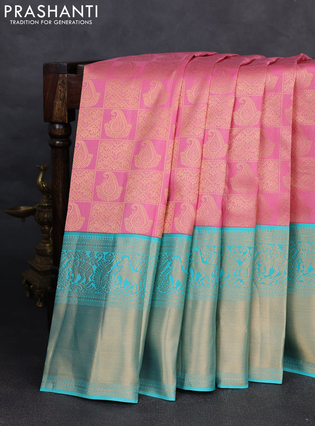 Pure kanchipuram silk saree light pink and teal blue with allover zari woven brocade weaves and long rich zari woven korvai border