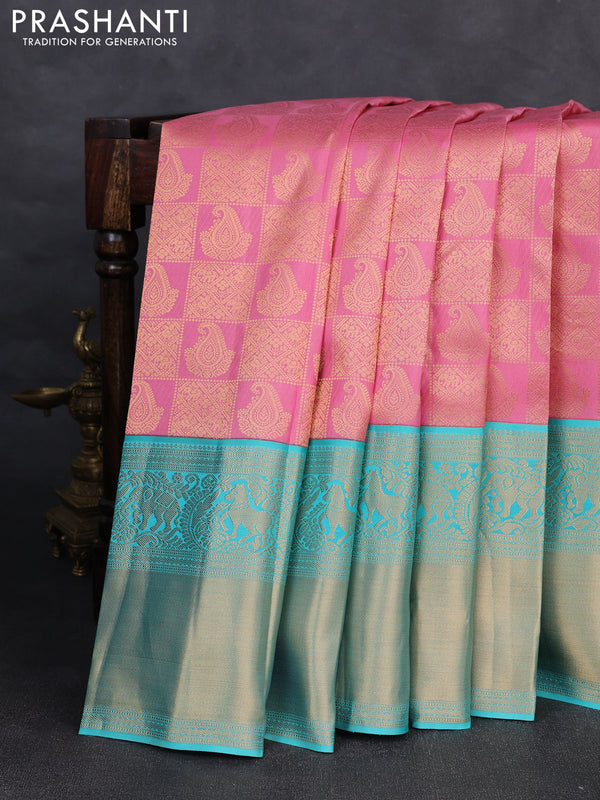 Pure kanchipuram silk saree light pink and teal blue with allover zari woven brocade weaves and long rich zari woven korvai border