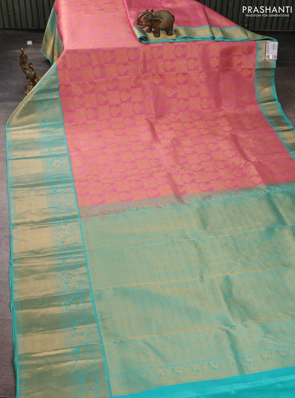 Pure kanchipuram silk saree light pink and teal blue with allover zari woven brocade weaves and long rich zari woven korvai border