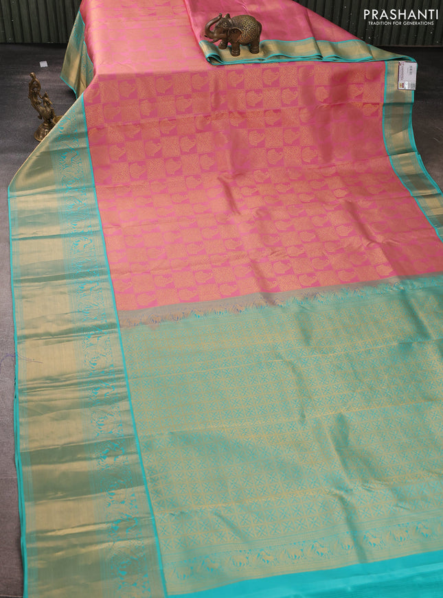 Pure kanchipuram silk saree light pink and teal blue with allover zari woven brocade weaves and long rich zari woven korvai border