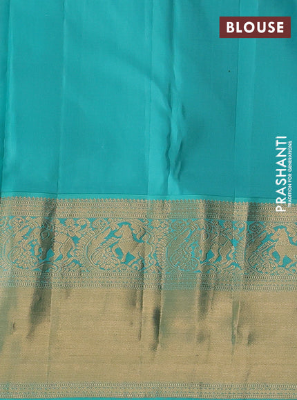 Pure kanchipuram silk saree light pink and teal blue with allover zari woven brocade weaves and long rich zari woven korvai border