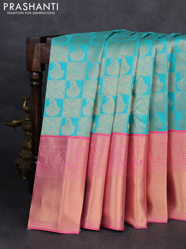 Pure kanchipuram silk saree teal blue and peach pink with allover zari woven brocade weaves and long rich zari woven korvai border