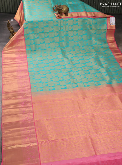 Pure kanchipuram silk saree teal blue and peach pink with allover zari woven brocade weaves and long rich zari woven korvai border