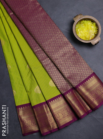 Semi kanchipuram silk saree light green and magenta pink with allover zari weaves & buttas and zari woven border