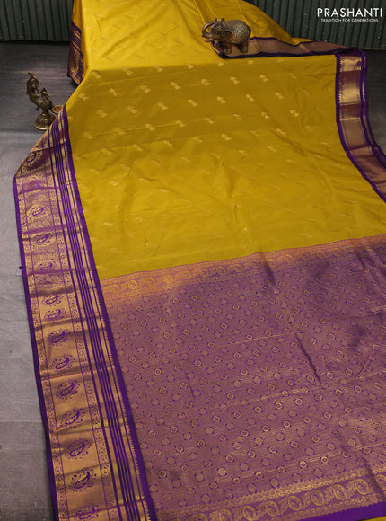 Semi kanchipuram silk saree mustard green and deep purple with allover zari woven buttas and zari woven border