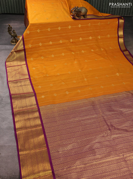 Semi kanchipuram silk saree mustard yellow and purple with allover zari weaves & buttas and zari woven border