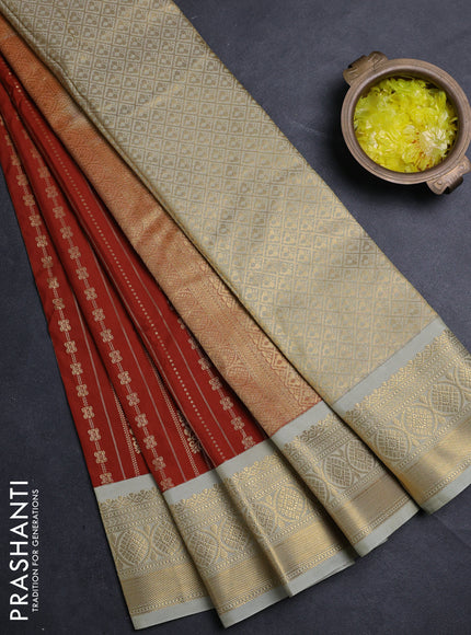 Semi kanchipuram silk saree rust shade and mild pista green with allover zari weaves & buttas and zari woven border