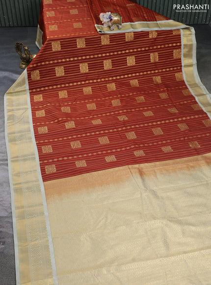 Semi kanchipuram silk saree rust shade and mild pista green with allover zari weaves & buttas and zari woven border