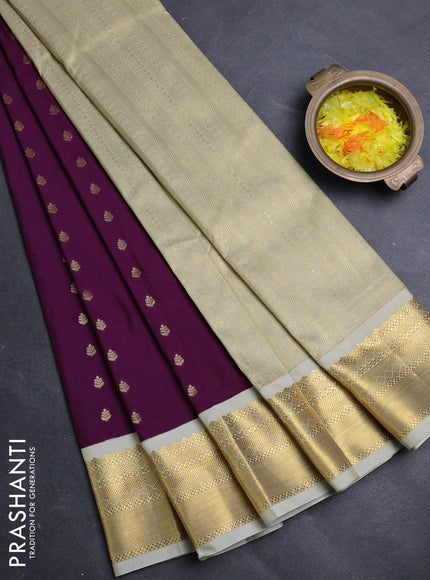Semi kanchipuram silk saree deep purple and mild pista green with allover zari woven buttas and zari woven border
