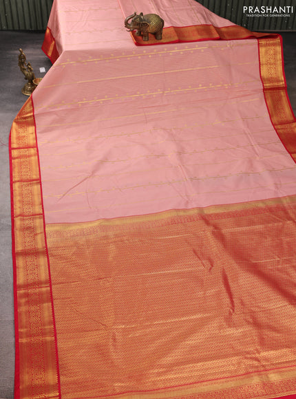 Semi kanchipuram silk saree peach shade and red with allover zari weaves & buttas and zari woven border