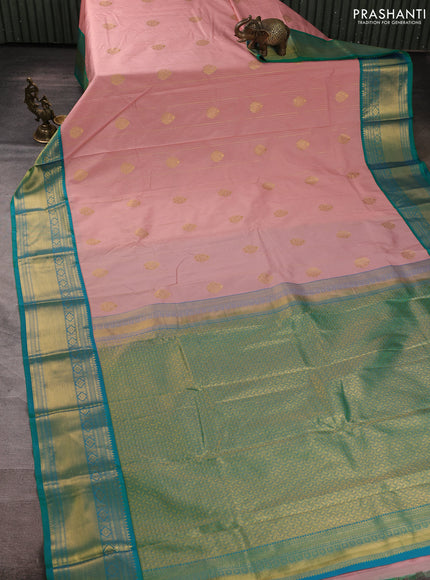 Semi kanchipuram silk saree mild peach pink and green with allover zari weaves & buttas and zari woven border