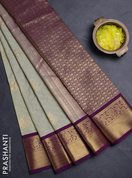 Semi kanchipuram silk saree mild pista green and deep purple with allover zari weaves & buttas and zari woven border