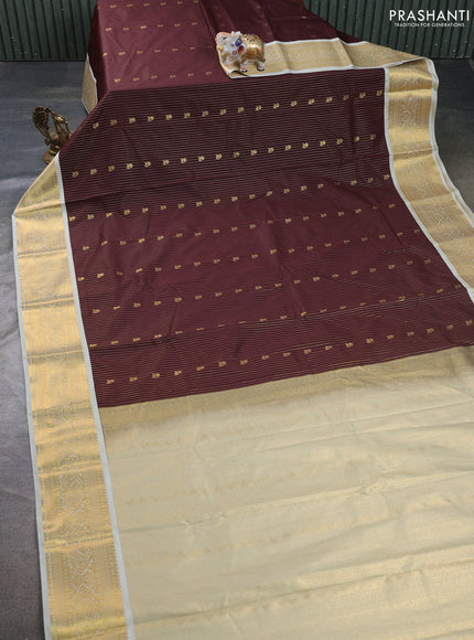 Semi kanchipuram silk saree coffee brown and mild pista green with allover zari weaves & buttas and zari woven border