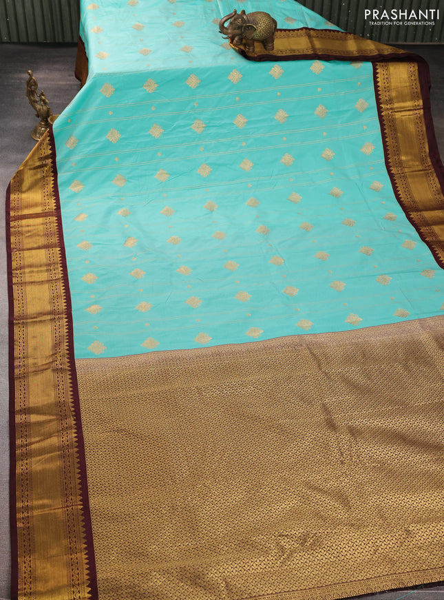 Semi kanchipuram silk saree teal blue and coffee brown with allover zari weaves & buttas and zari woven border