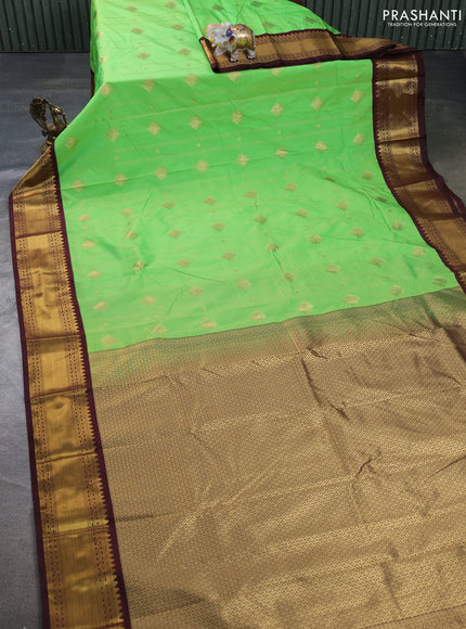Semi kanchipuram silk saree light green and coffee brown with allover zari weaves & buttas and zari woven border