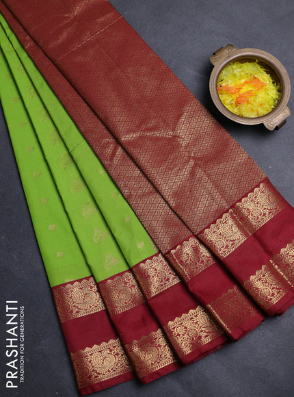 Semi kanchipuram silk saree light green and maroon with allover zari woven buttas and rettapet zari woven border
