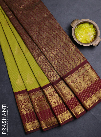 Semi kanchipuram silk saree light green and deep maroon with allover zari weaves & buttas and long zari woven korvai border
