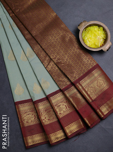 Semi kanchipuram silk saree pastel green and deep maroon with allover zari weaves & buttas and long zari woven korvai border